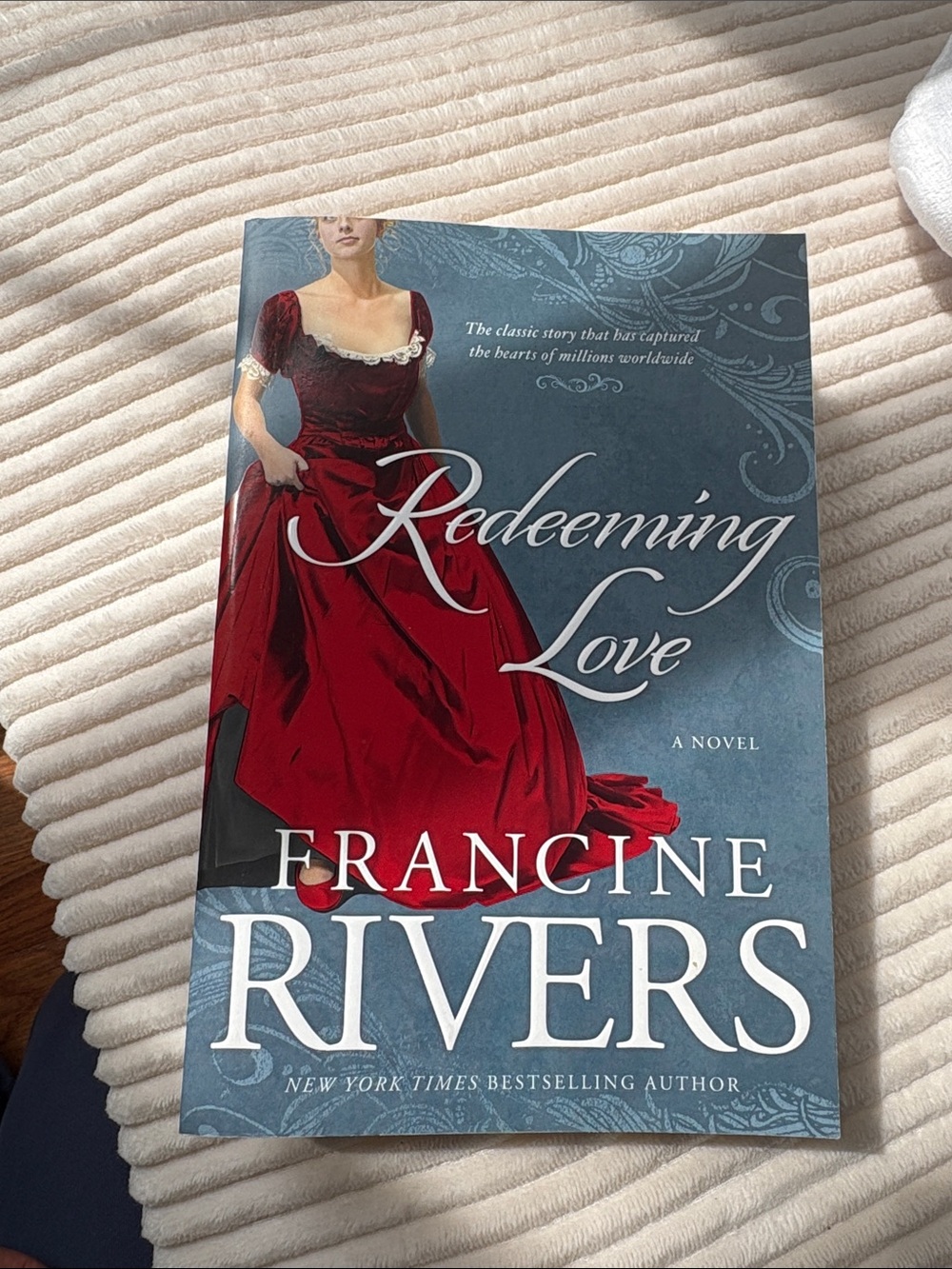 Redeeming Love by Francine Rivers - Red and Blue Paperback Novel